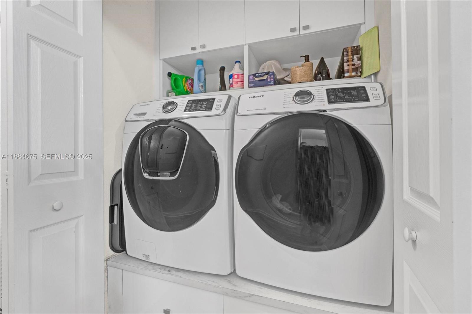 11413 Southwest 253rd Street, Unit 11413 Homestead, FL 33032 - Photo 39 of 44 a utility room with dryer and washer