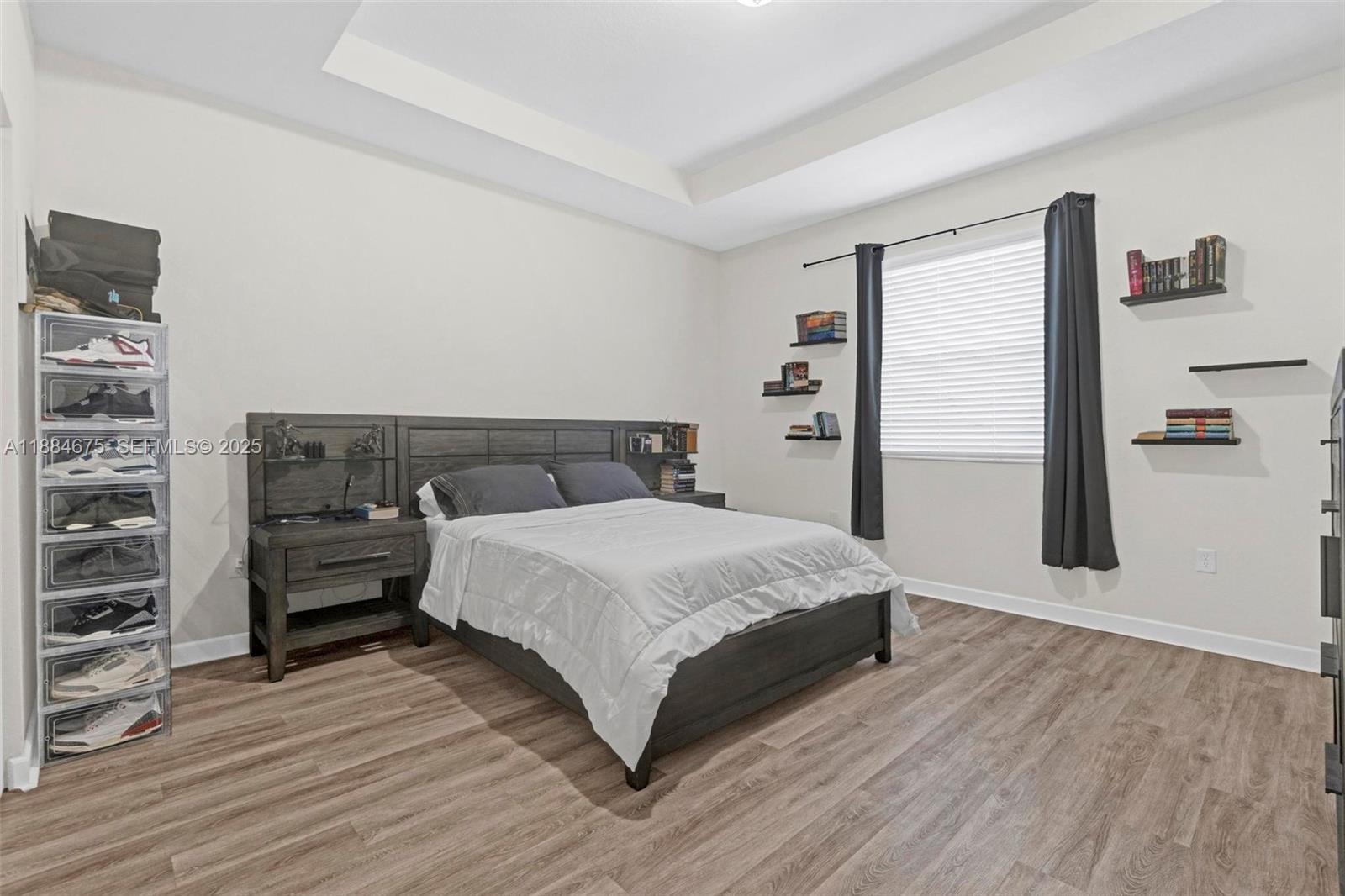 11413 Southwest 253rd Street, Unit 11413 Homestead, FL 33032 - Photo 10 of 44 a bedroom with a bed and wooden floor