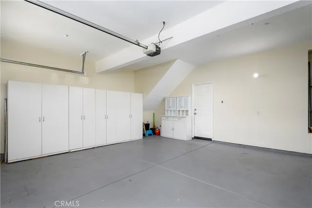 a view of an empty room with racks on the wall