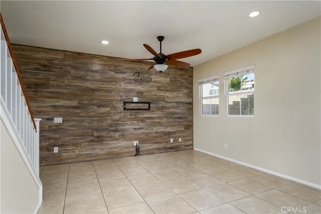 a view of kitchen with stove microwave and cabinets