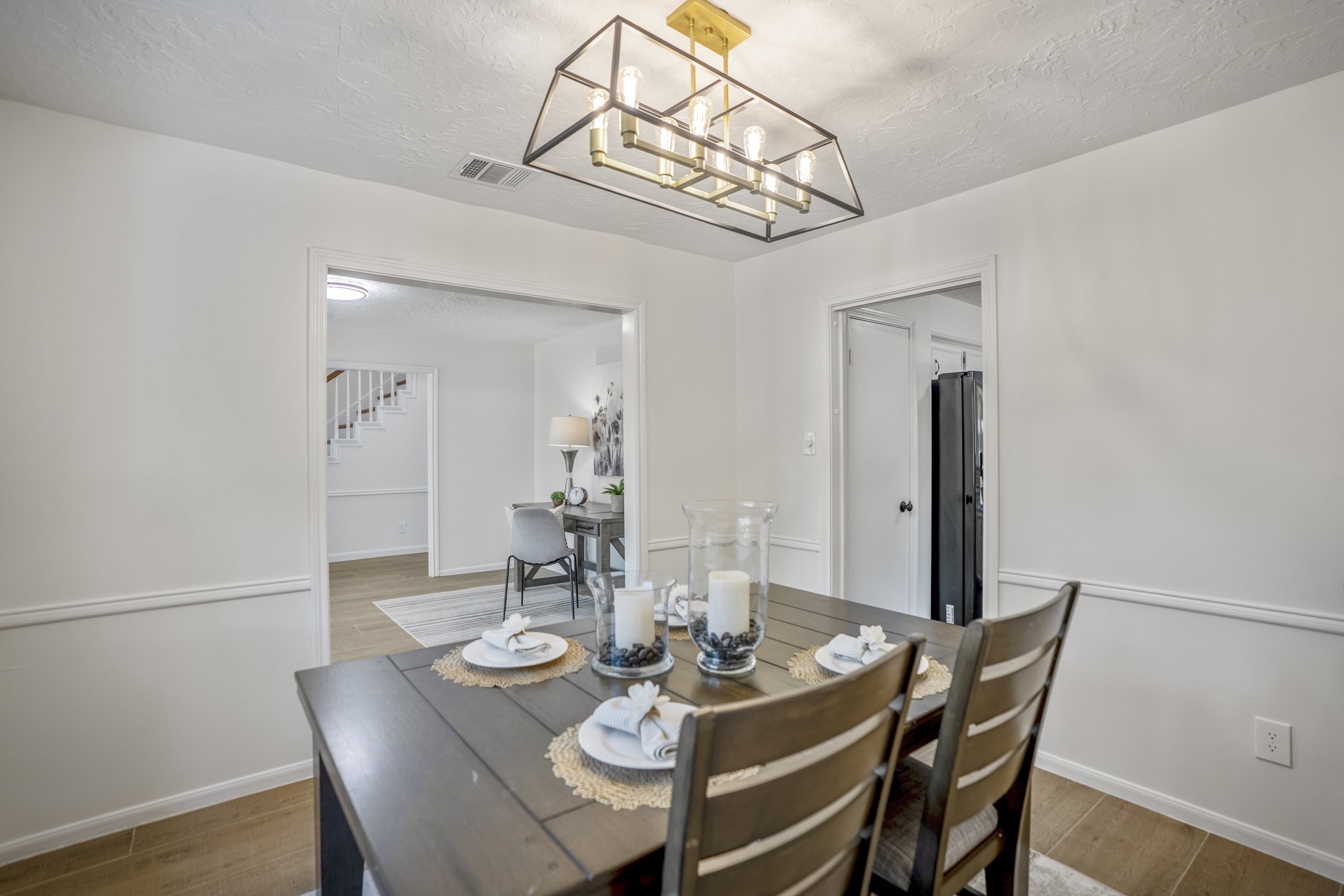 6303 Larkmount Drive Spring, TX 77389 - Photo 10 of 50 Circling through the dining room, the connected layout becomes even more apparent with views back into the formal living room and foyer beyond. Off to the right, the kitchen begins to come into view through the doorway, keeping the main gathering spaces closely tied together for both everyday routines and larger get-togethers