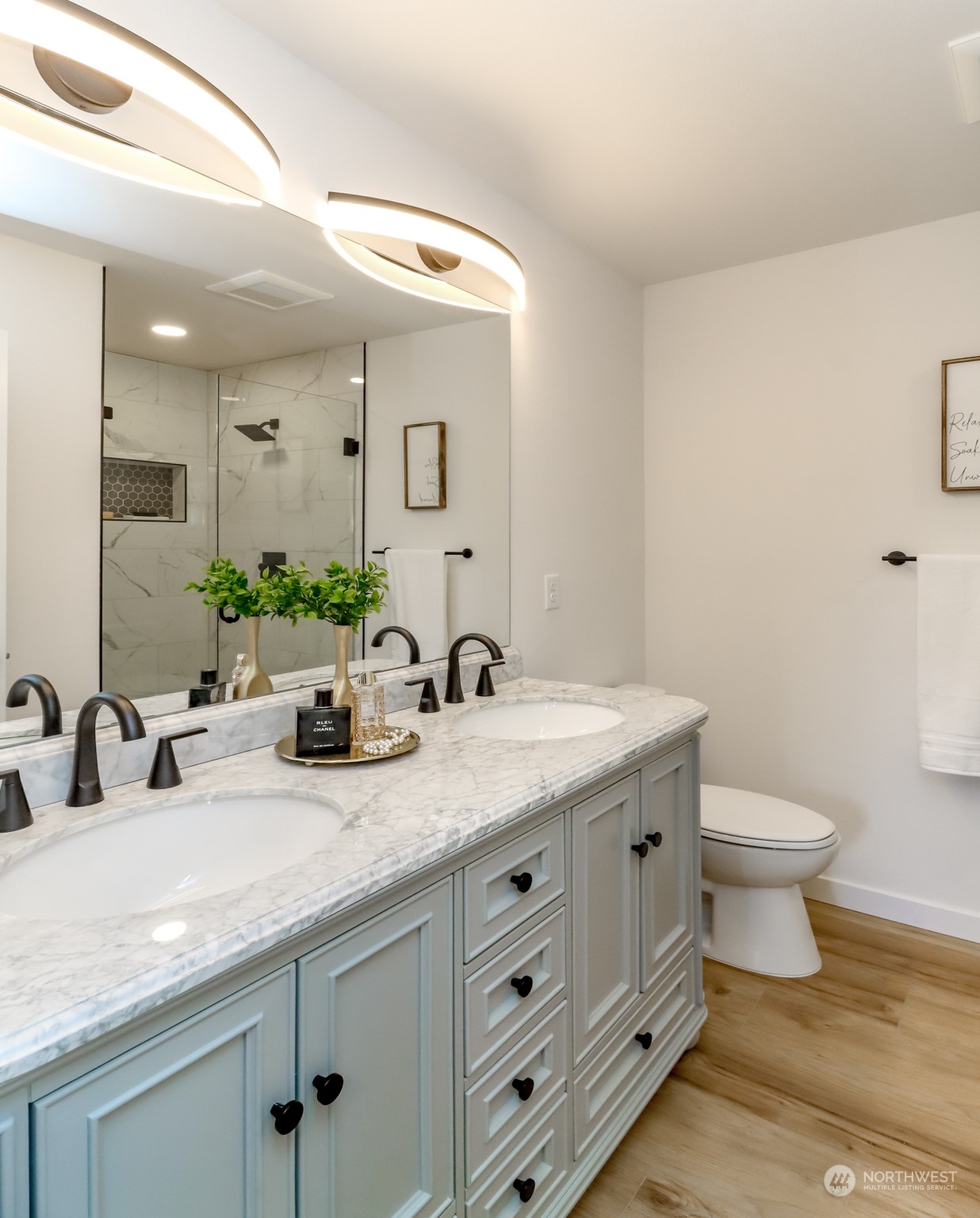 21220 Maxwell Road Southeast Maple Valley, WA 98038 - Photo 22 of 40 a bathroom with a granite countertop sink mirror and toilet