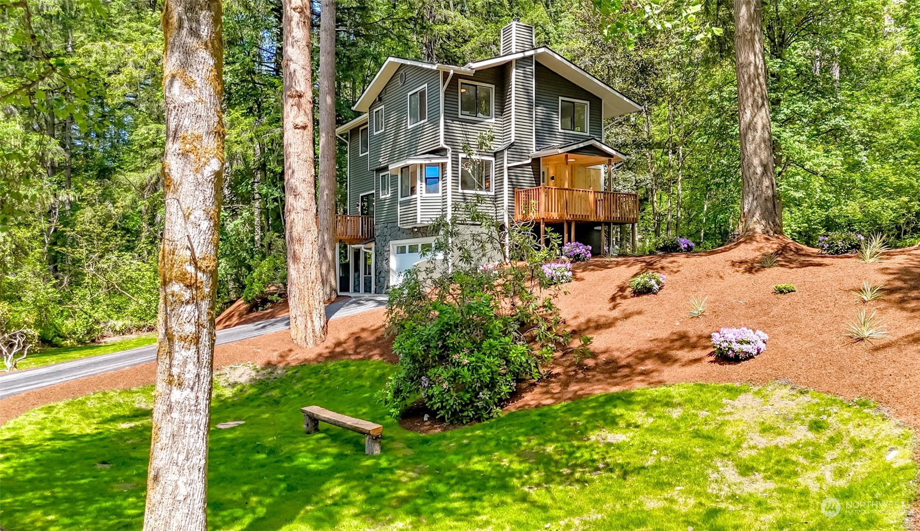 21220 Maxwell Road Southeast Maple Valley, WA 98038 - Photo 4 of 40 a front view of a house with a yard and tree s