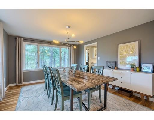247 Sandy Pond Road Concord, MA 01773 - Photo 1 of 20 a view of a dining room with furniture window and wooden floor