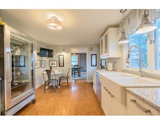 247 Sandy Pond Road Concord, MA 01773 - Photo 11 of 20 a open kitchen with stainless steel appliances granite countertop a sink and cabinets