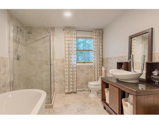 247 Sandy Pond Road Concord, MA 01773 - Photo 15 of 20 a bathroom with a sink a toilet a mirror and bathtub