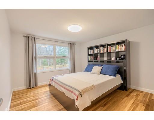 247 Sandy Pond Road Concord, MA 01773 - Photo 16 of 20 a bedroom with a large bed and a large window