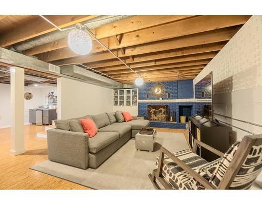 247 Sandy Pond Road Concord, MA 01773 - Photo 17 of 20 a living room with furniture a flat screen tv and a table