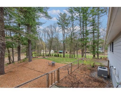 247 Sandy Pond Road Concord, MA 01773 - Photo 20 of 20 a backyard of a house with lots of green space