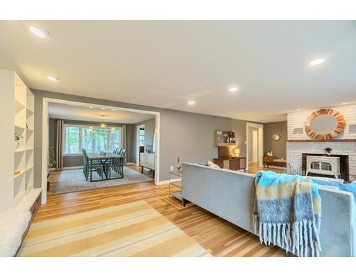 247 Sandy Pond Road Concord, MA 01773 - Photo 8 of 20 a living room with fireplace furniture and a large window