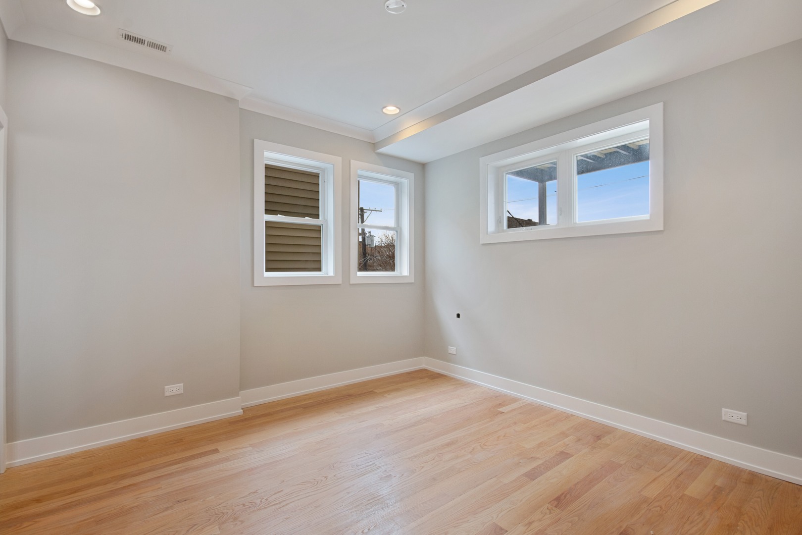 3750 North Racine Avenue, Unit 2 Chicago, IL 60613 - Photo 5 of 10 a view of a room with wooden floor and windows