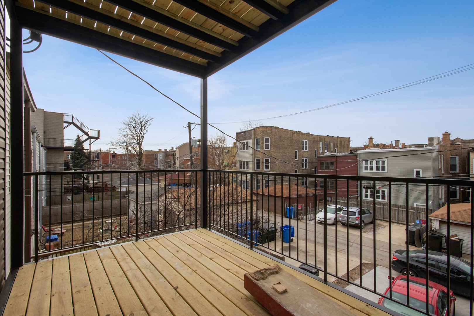 3750 North Racine Avenue, Unit 2 Chicago, IL 60613 - Photo 10 of 10 a view of balcony with wooden floor