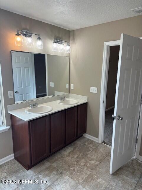 9670 Freefall Road Jacksonville, FL 32221 - Photo 21 of 31 a bathroom with a sink and a mirror