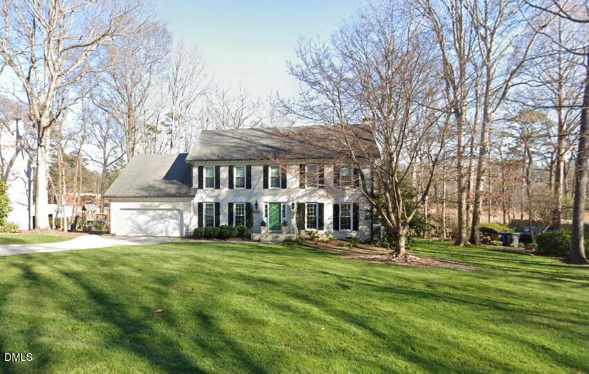 7824 Hardwick Drive Raleigh, NC 27615 - Photo 1 of 15 a view of a house with a big yard and large trees