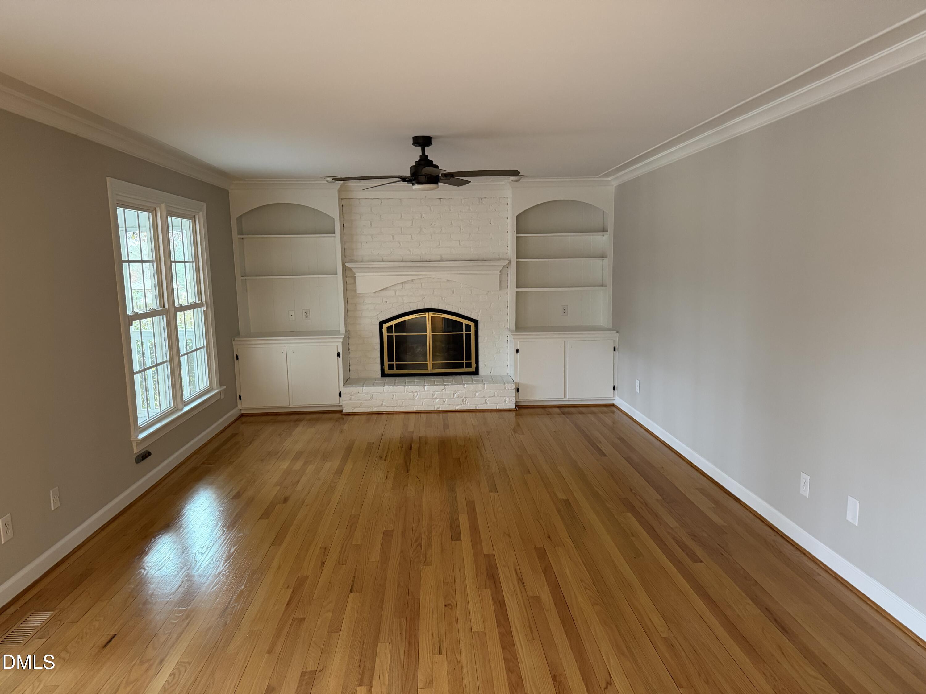 7824 Hardwick Drive Raleigh, NC 27615 - Photo 12 of 15 a view of empty room with wooden floor and fan