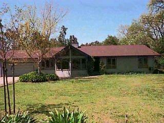 191 Middle Rincon Road Santa Rosa, CA 95409 - Photo 1 of 1 a front view of a house with a yard