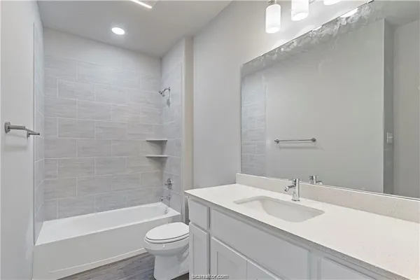 an empty room with a window and ceiling fan