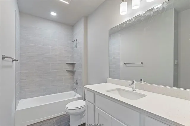 an empty room with a window and ceiling fan