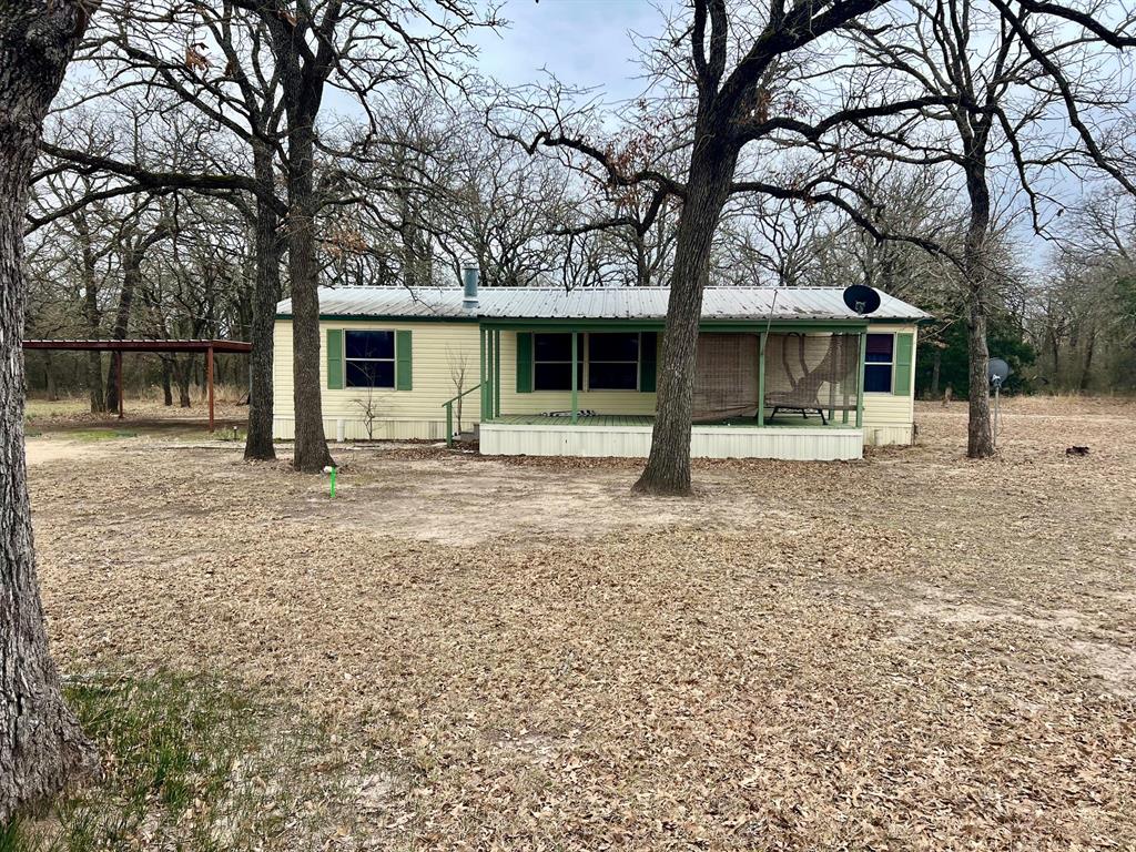 a house with trees in front of it