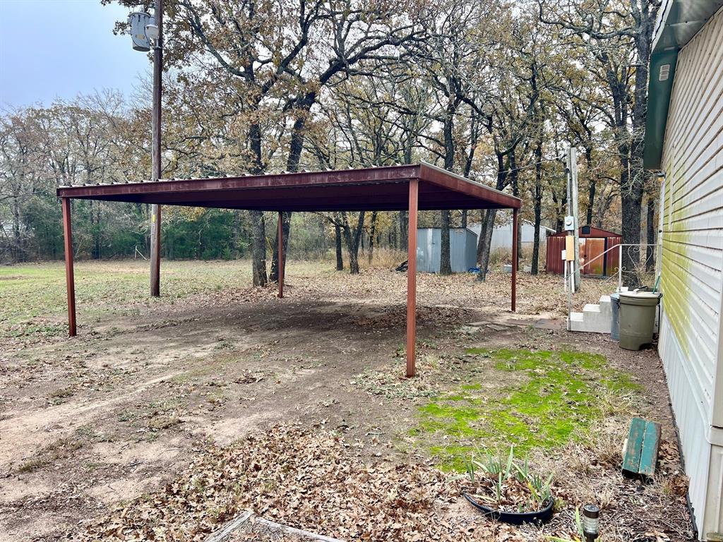 620 Cr 109 Road Riesel, TX 76682 - Photo 12 of 27 a backyard of a house with barbeque oven table and chairs