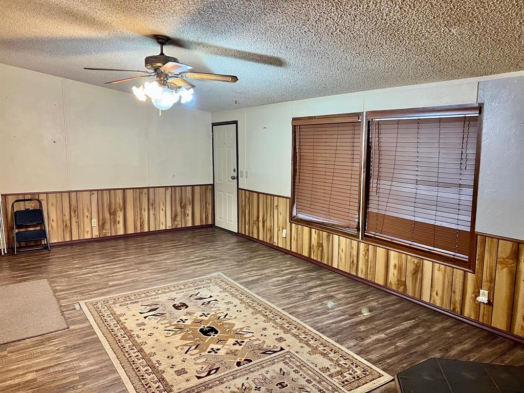 620 Cr 109 Road Riesel, TX 76682 - Photo 10 of 26 an empty room with wooden floor
