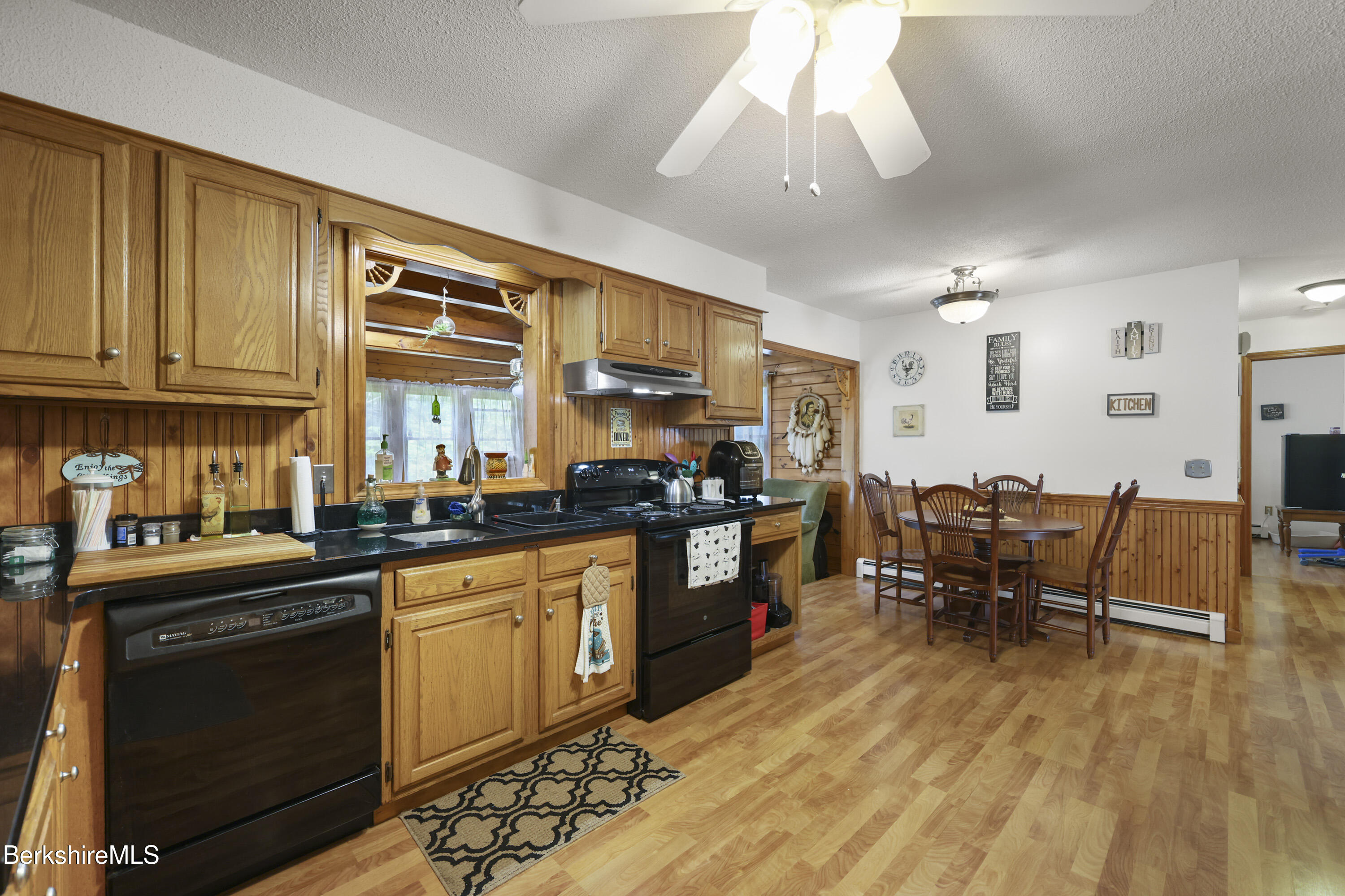 712 Barker Road Pittsfield, MA 01201 - Photo 9 of 39 a kitchen with lots of counter top space and dining table