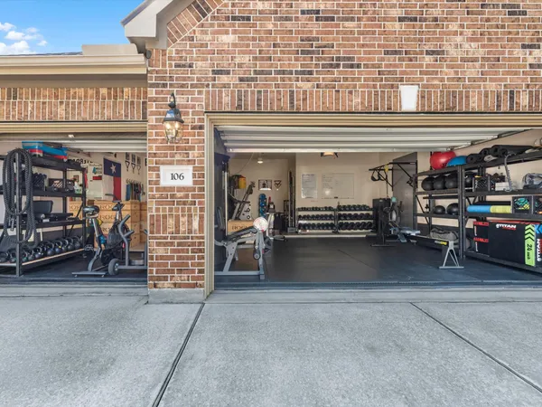 a view of a garage with parked cars