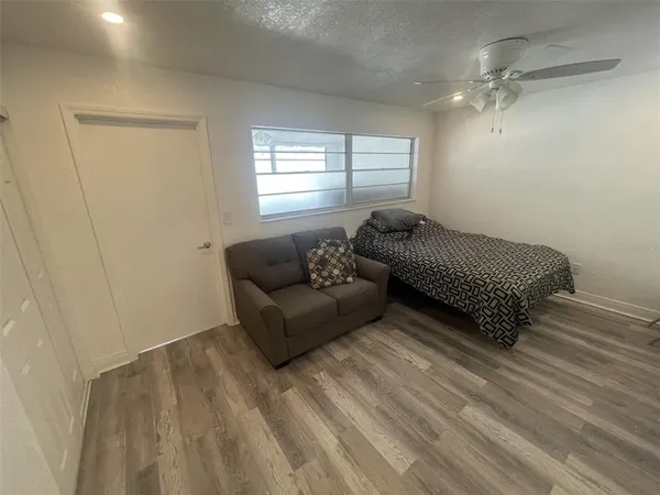 a living room with furniture and a window