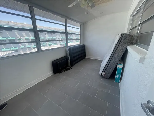 a living room with a couch and a large window