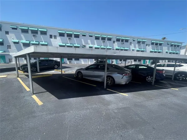 a car parked in parking lot of a building