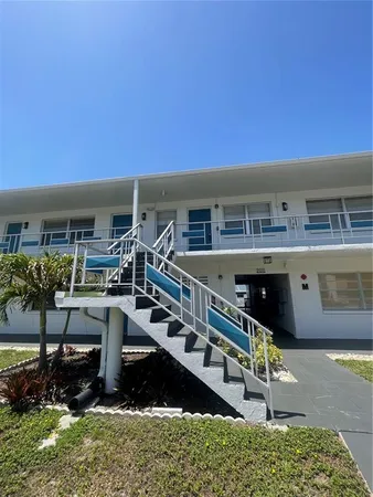 a view of a chairs and table in a patio