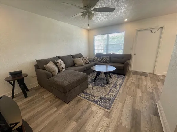 a living room with furniture and a window