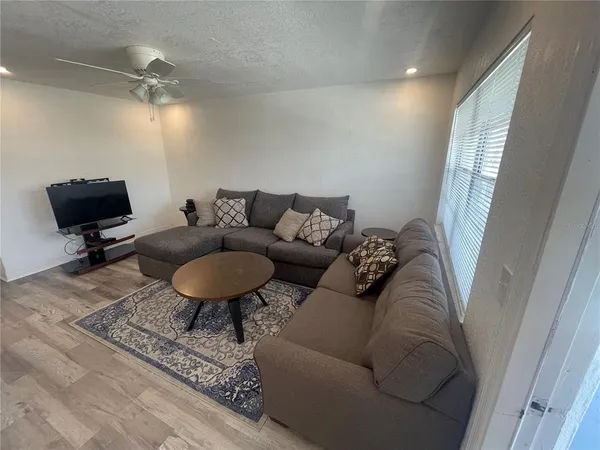 a living room with furniture and a rug