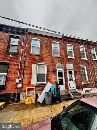 a front view of a residential apartment building with glass windows