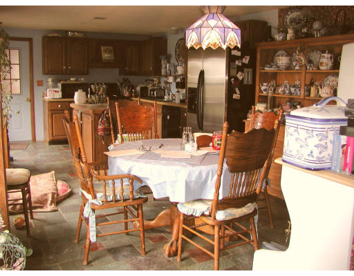 50-52 Holcomb Road Chester, MA 01011 - Photo 2 of 11 a dining area with furniture and chandelier