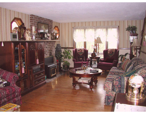 50-52 Holcomb Road Chester, MA 01011 - Photo 3 of 11 a living room with furniture and large windows