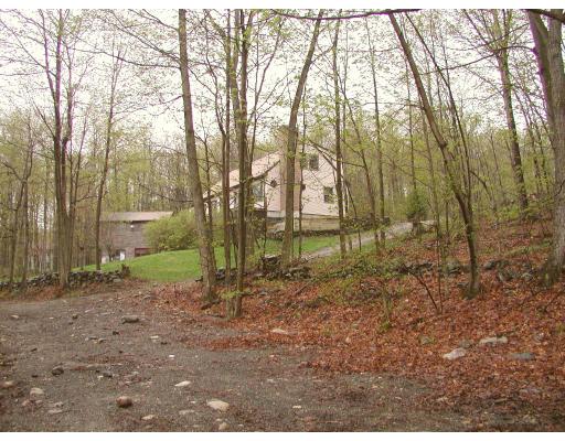 50-52 Holcomb Road Chester, MA 01011 - Photo 8 of 11 a backyard of a house with lots of green space