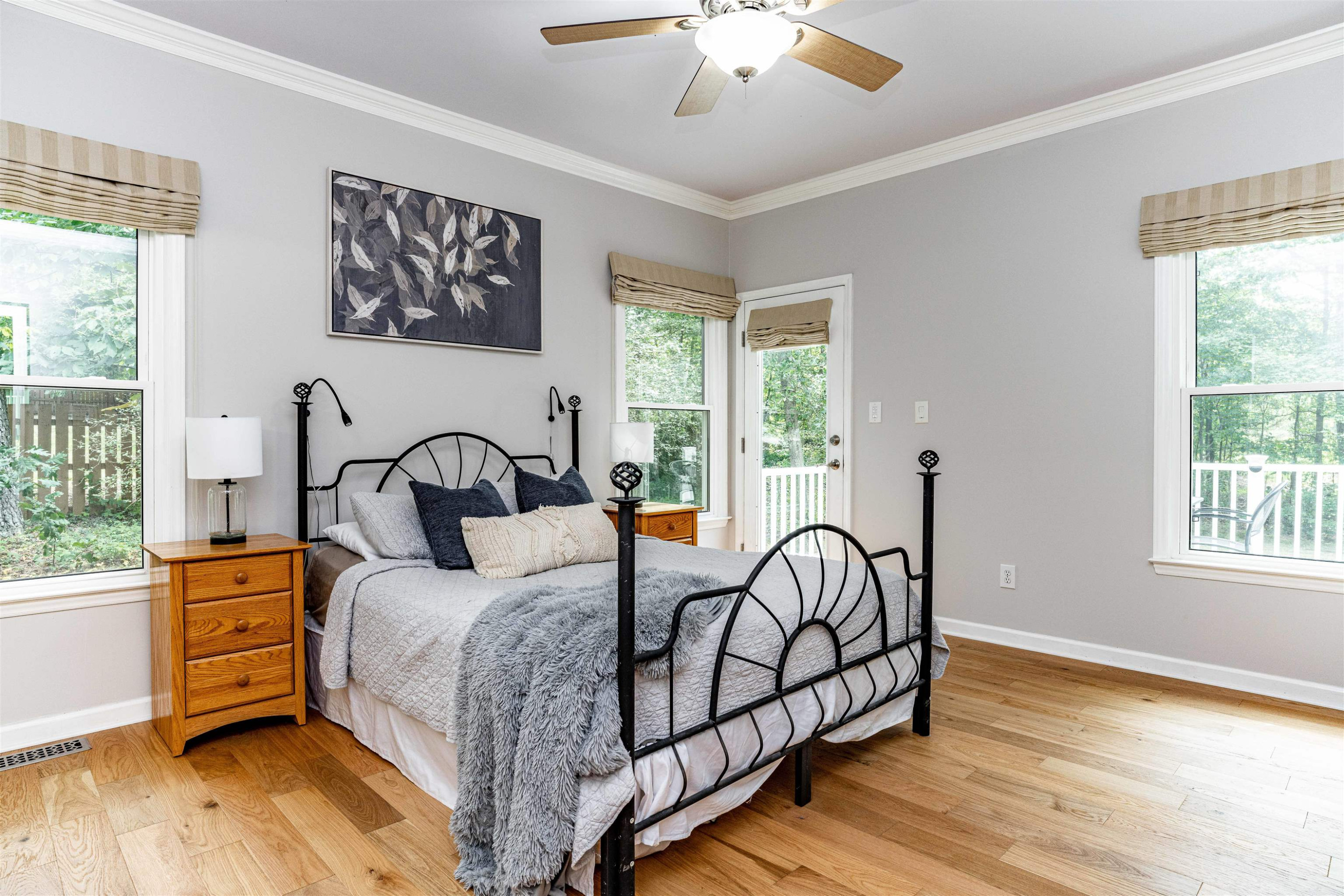 407 Catlin Road Cary, NC 27519 - Photo 11 of 42 a bedroom with a bed and a chandelier
