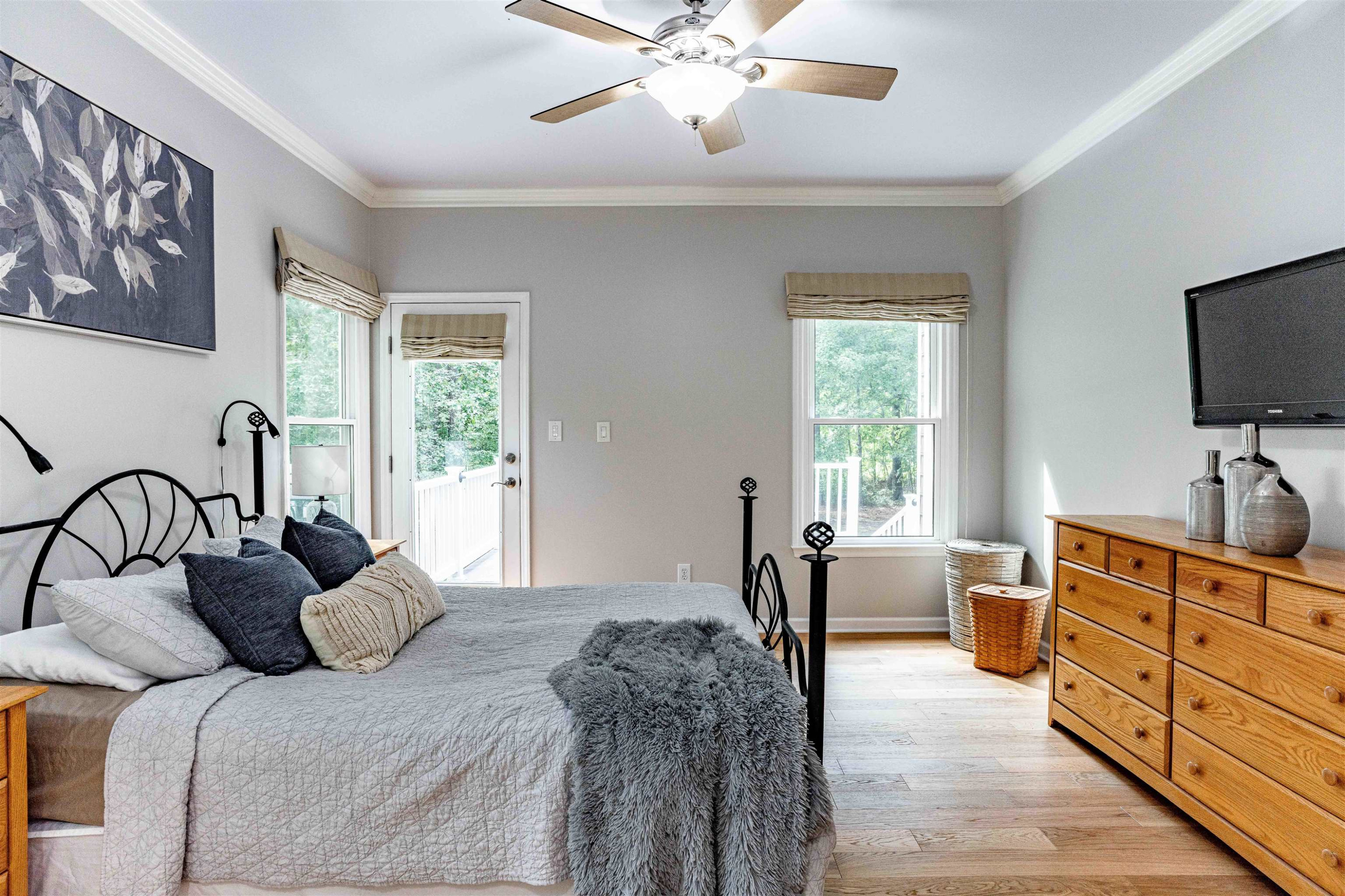 407 Catlin Road Cary, NC 27519 - Photo 12 of 42 a bedroom with furniture and a flat screen tv
