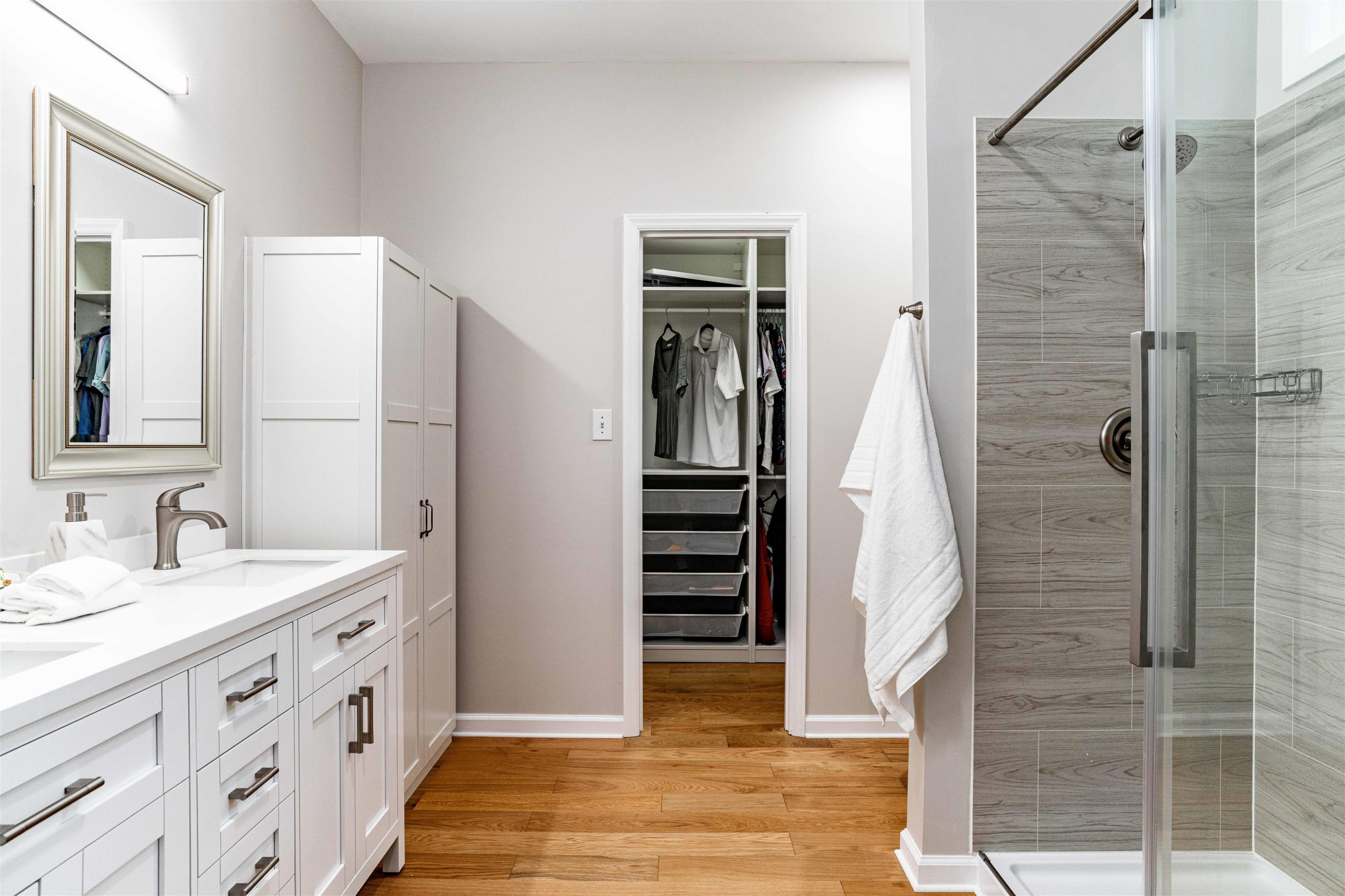 407 Catlin Road Cary, NC 27519 - Photo 13 of 42 a bathroom with a double vanity sink and a mirror