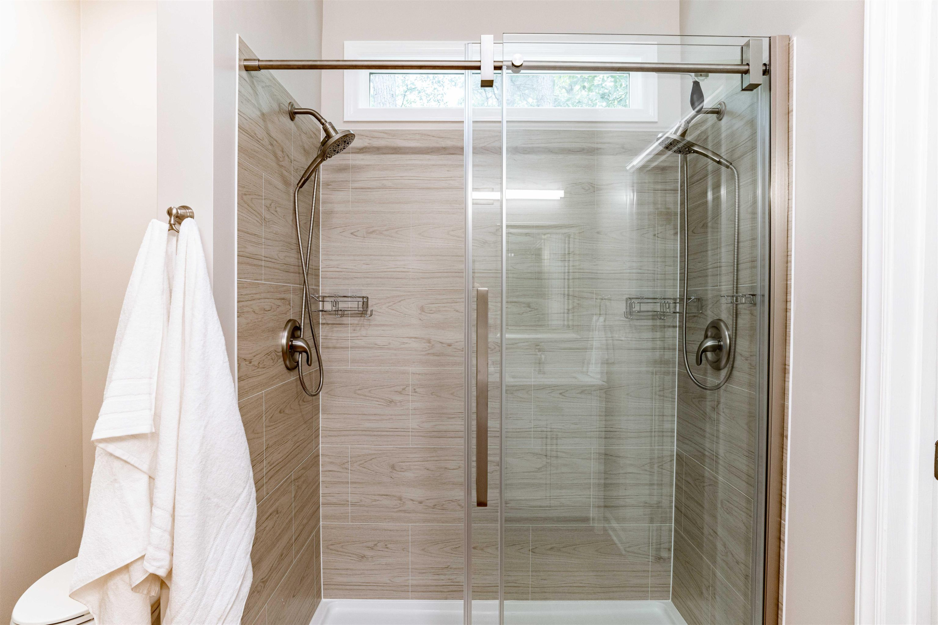 407 Catlin Road Cary, NC 27519 - Photo 15 of 42 a bathroom with a shower and a glass door