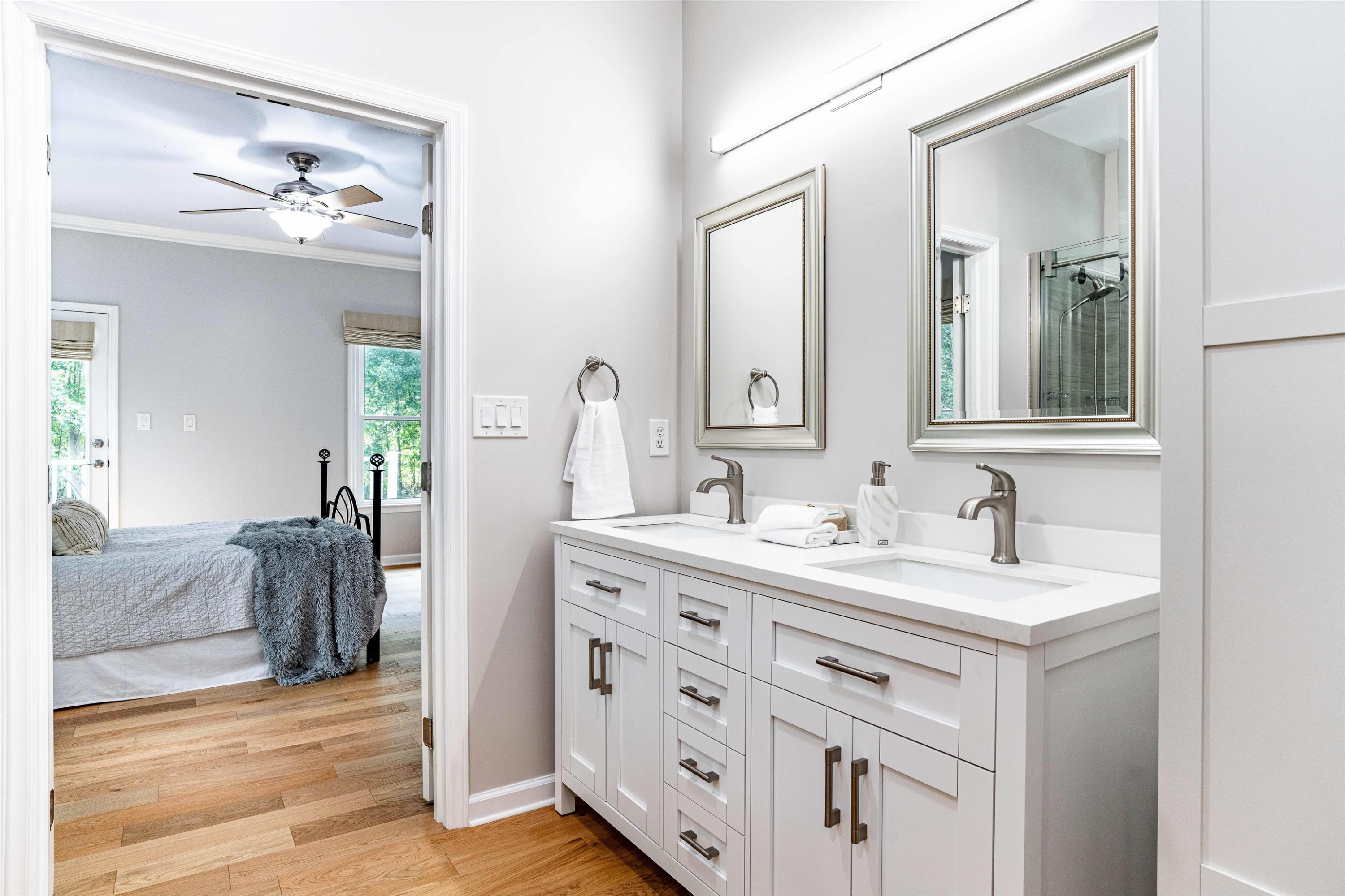 407 Catlin Road Cary, NC 27519 - Photo 16 of 42 a bathroom with a double vanity sink and a mirror