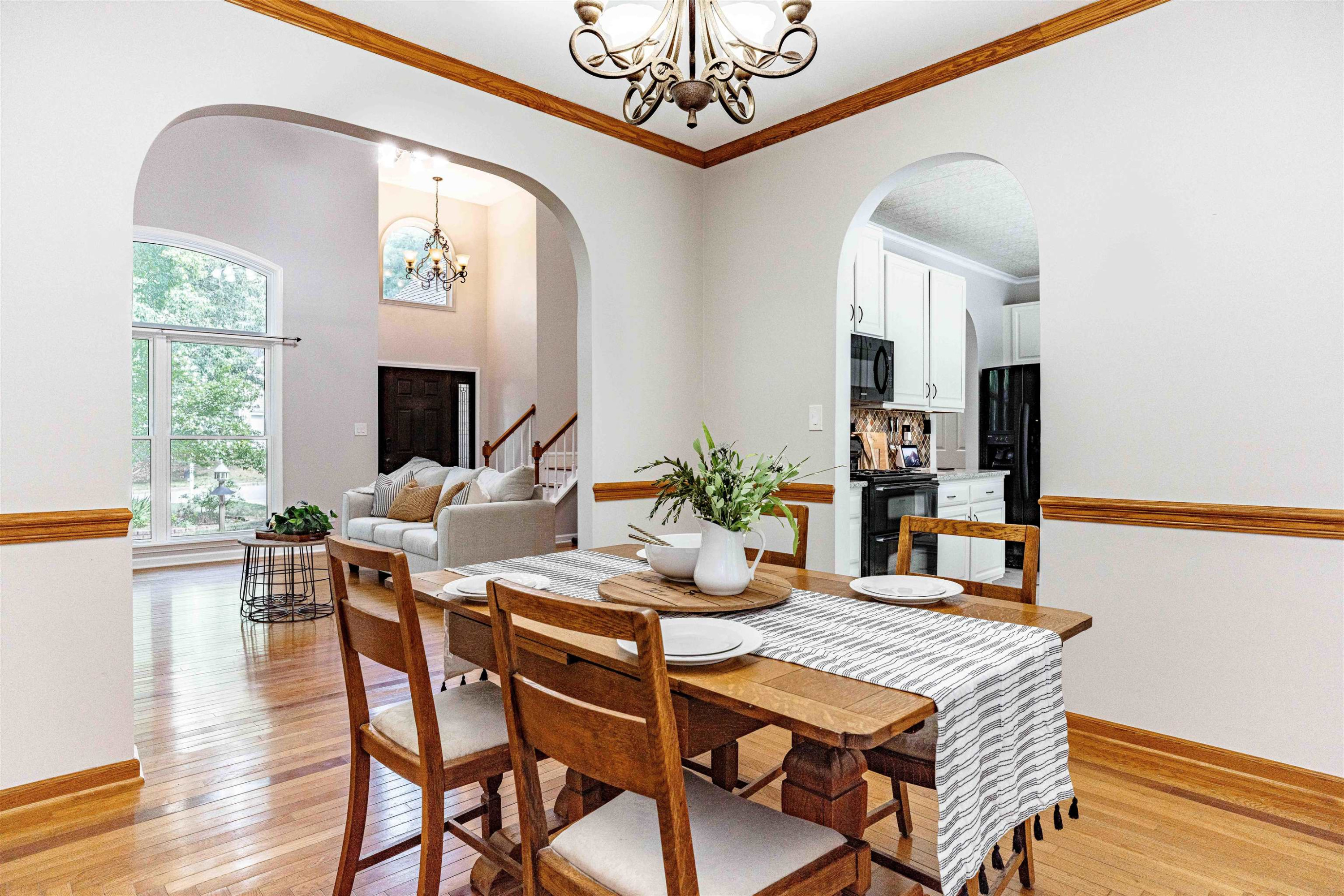 407 Catlin Road Cary, NC 27519 - Photo 18 of 42 a dining room with furniture a fireplace and wooden floor
