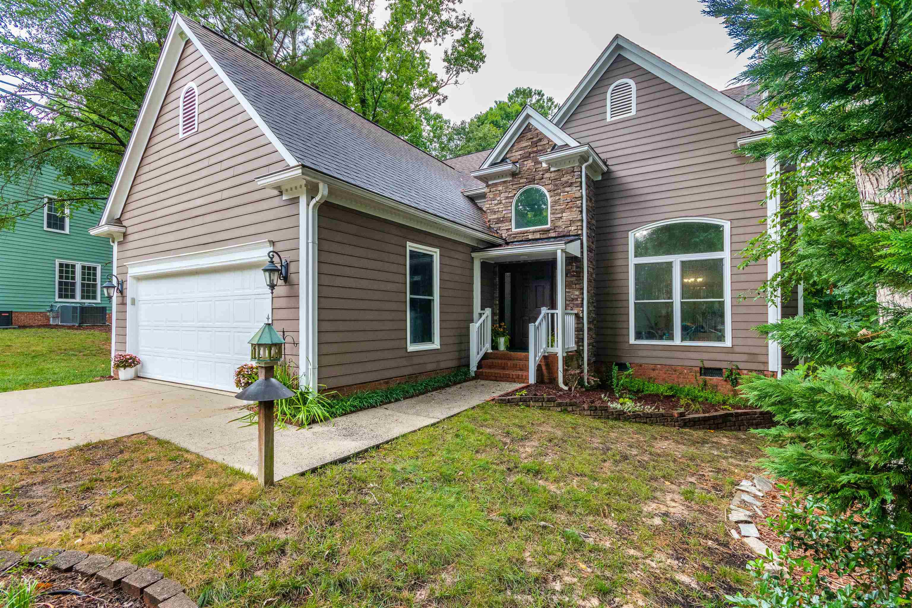 407 Catlin Road Cary, NC 27519 - Photo 2 of 42 a front view of a house with garden