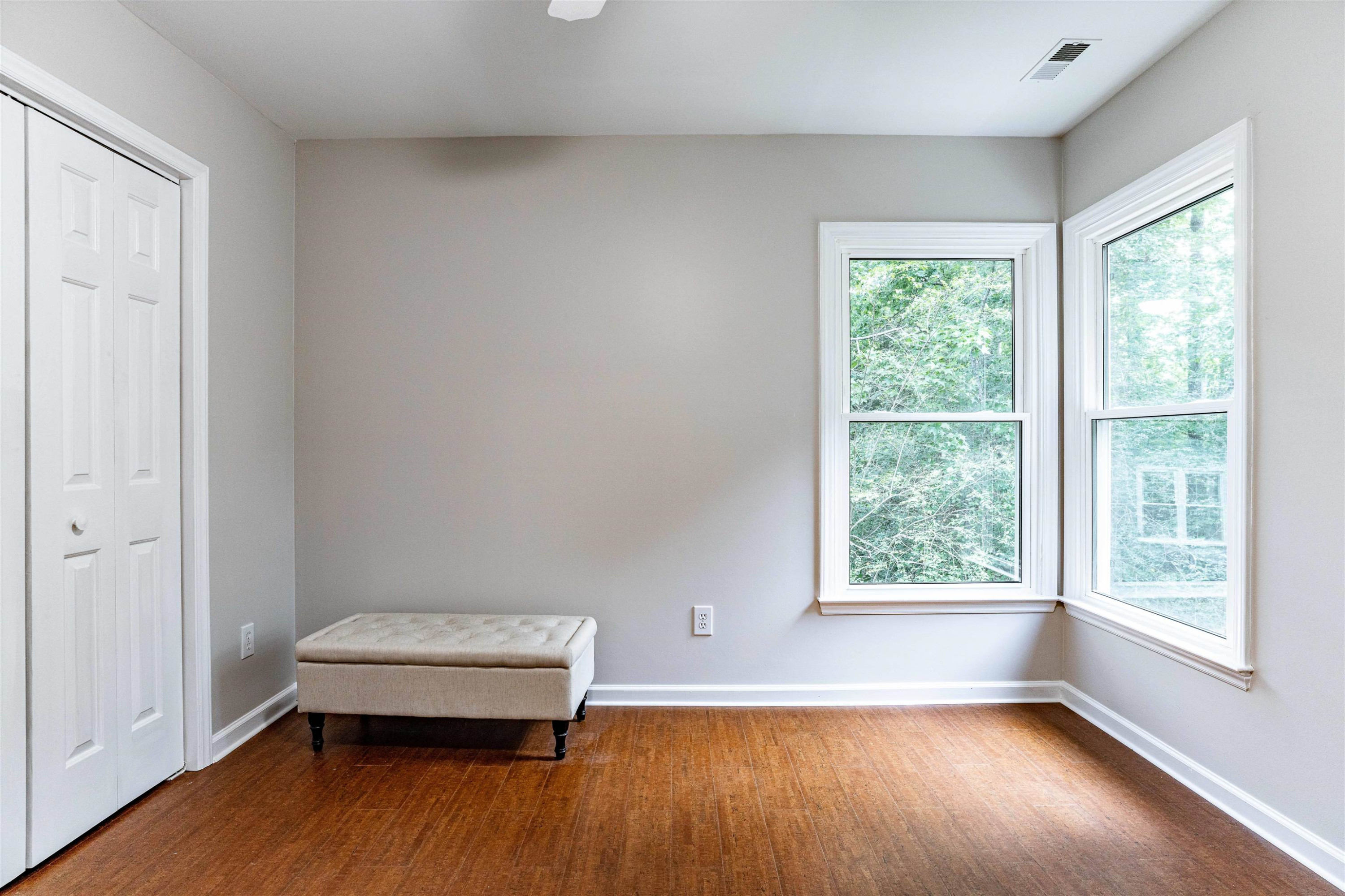 407 Catlin Road Cary, NC 27519 - Photo 25 of 42 an empty room with wooden floor and windows