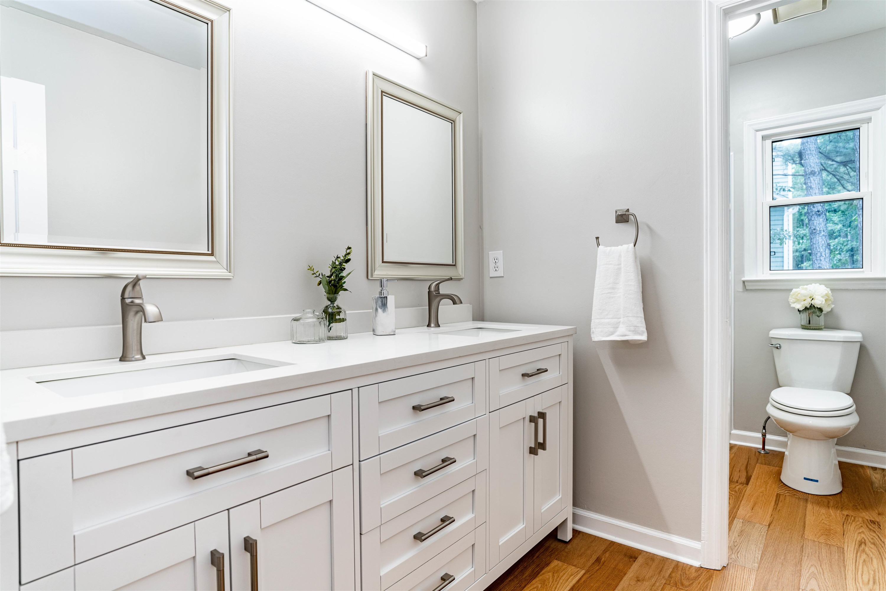 407 Catlin Road Cary, NC 27519 - Photo 27 of 42 a bathroom with a sink a toilet and a mirror