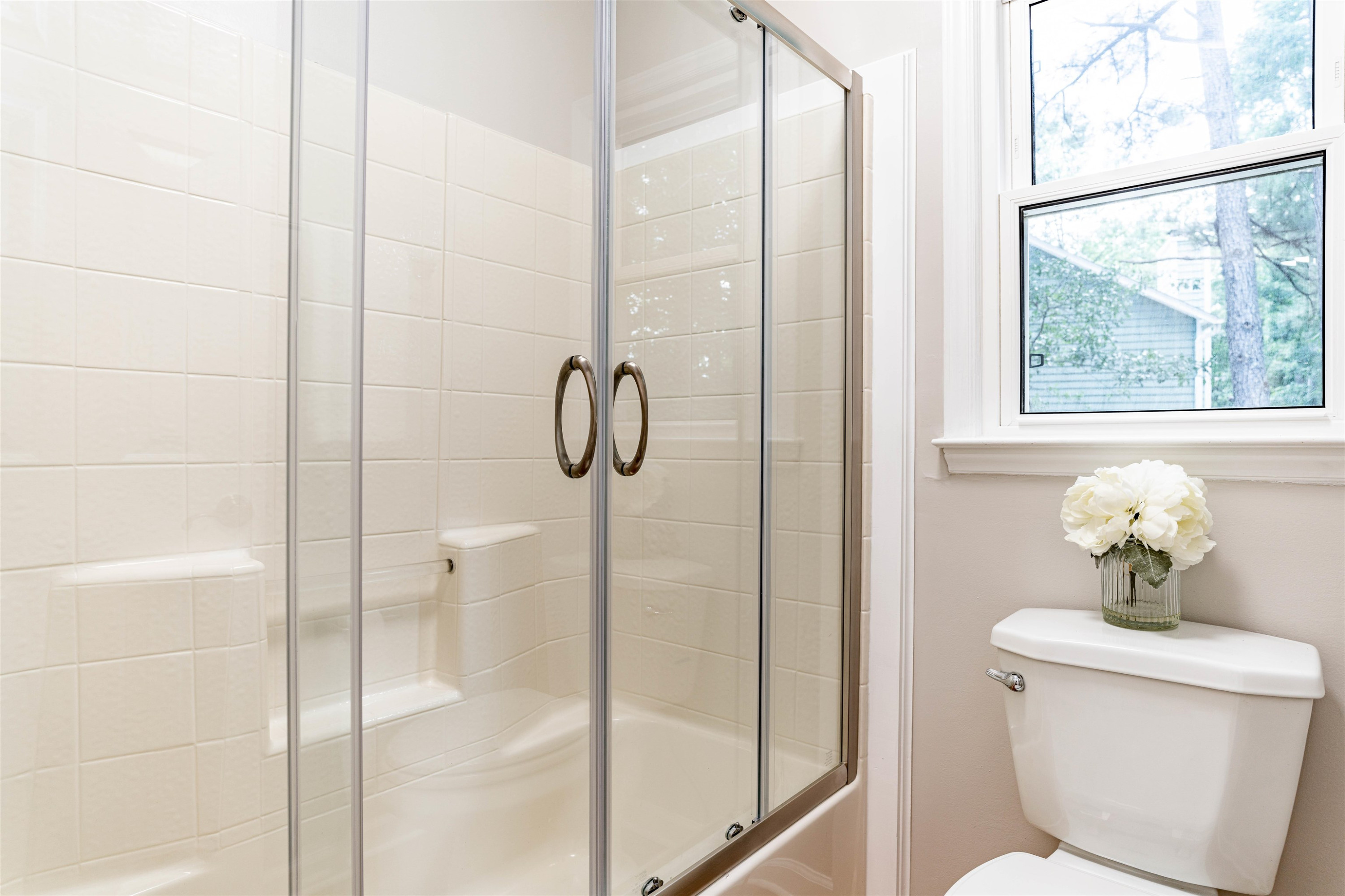 407 Catlin Road Cary, NC 27519 - Photo 28 of 42 a bathroom with a shower and a toilet