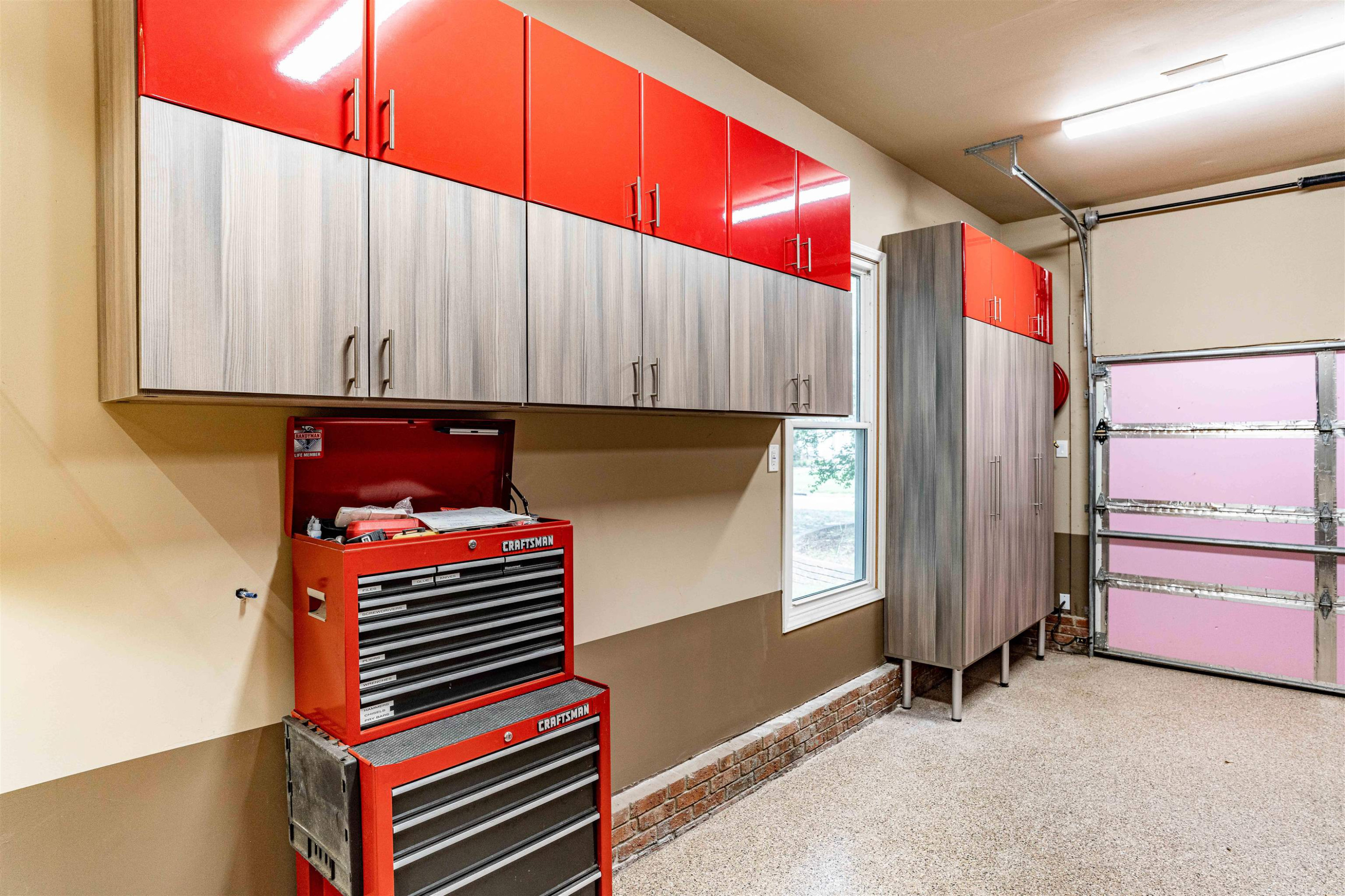 407 Catlin Road Cary, NC 27519 - Photo 41 of 42 a room with lots of white furniture and a window