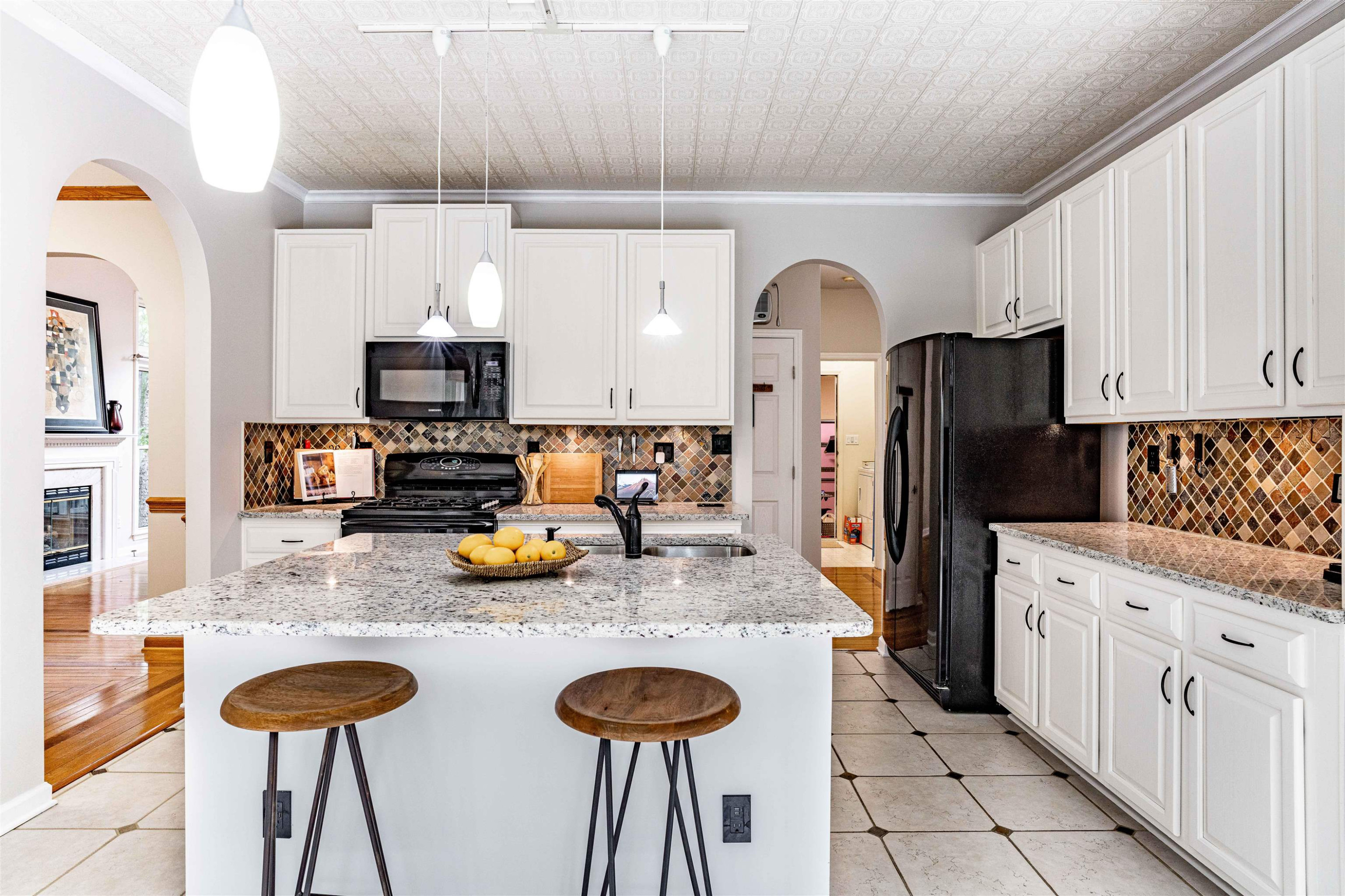 407 Catlin Road Cary, NC 27519 - Photo 6 of 42 a kitchen with stainless steel appliances granite countertop a sink refrigerator and cabinets