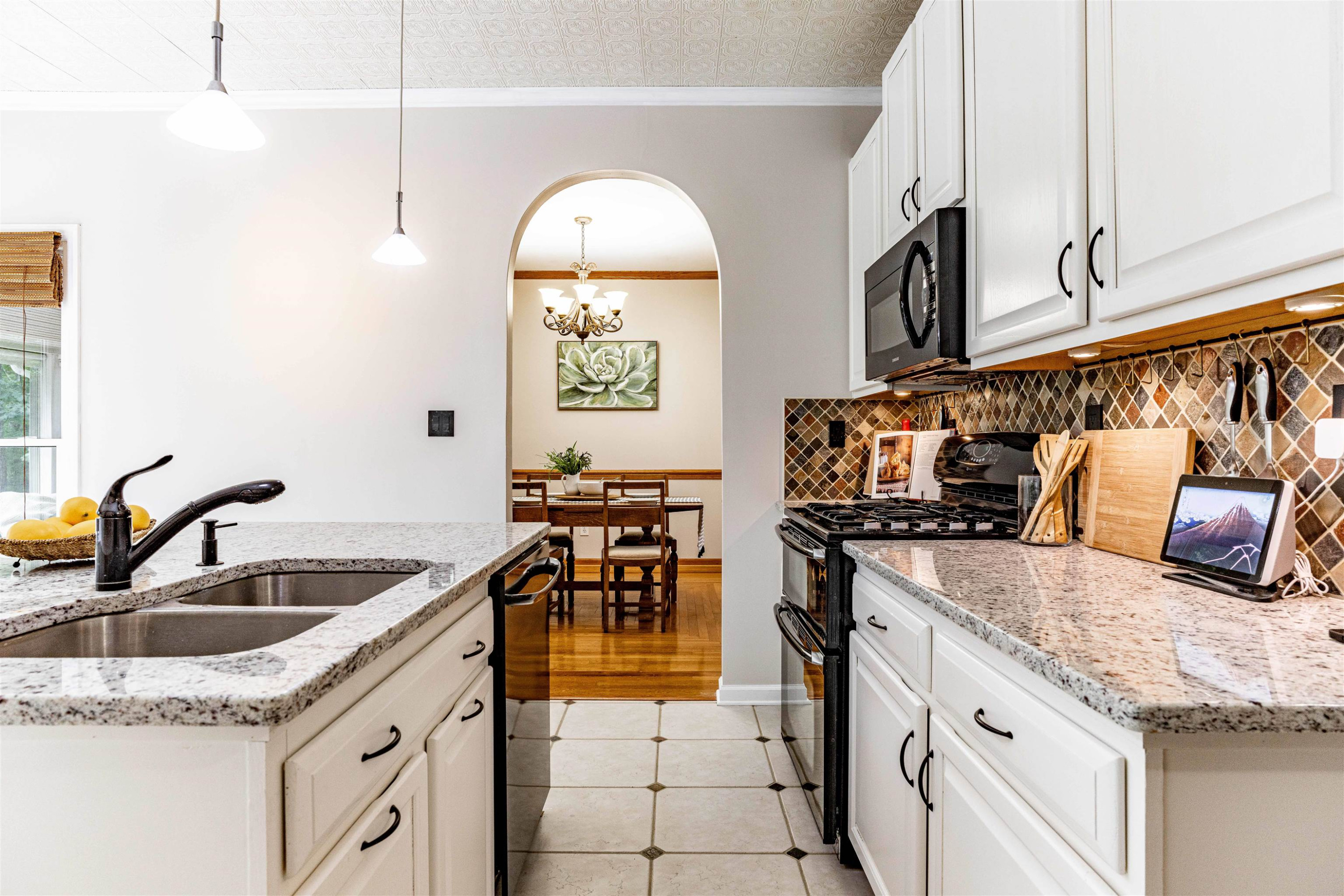 407 Catlin Road Cary, NC 27519 - Photo 7 of 42 a kitchen with stainless steel appliances granite countertop a sink stove and cabinets